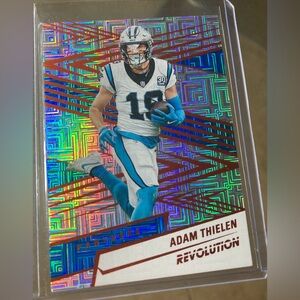 2025 Panini Revolution Adam Thielen #107 Orange Levels /299 Carolina Panthers